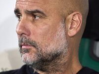 Pep Guardiola, Head Coach of Manchester City, looks on prior to the UEFA Champions League match between Sporting CP and Manchester City at J...