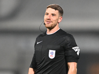 Referee David Harrison officiates during the EFL Trophy match between Cambridge United and Chelsea Under 21s at the Cledara Abbey Stadium in...