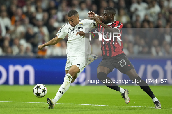 Kylian Mbappe centre-forward of Real Madrid and France and Fikayo Tomori centre-back of AC Milan and England compete for the ball during the...