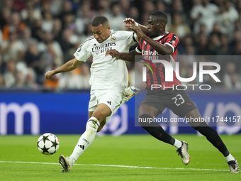 Kylian Mbappe centre-forward of Real Madrid and France and Fikayo Tomori centre-back of AC Milan and England compete for the ball during the...