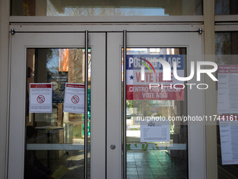 People cast their ballots for President, Congress, and local races for the 2024 election at the Museum of Contemporary Art in Arlington, VA,...