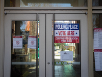 People cast their ballots for President, Congress, and local races for the 2024 election at the Museum of Contemporary Art in Arlington, VA,...