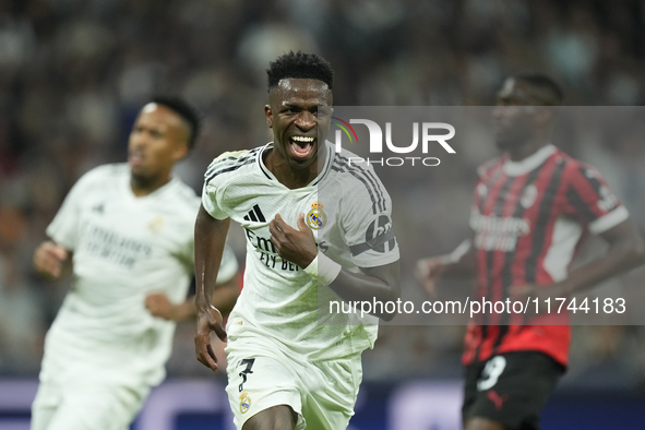 Vinicius Junior left winger of Real Madrid and Brazil celebrates after scoring his sides first goal during the UEFA Champions League 2024/25...