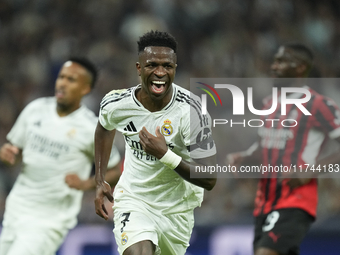 Vinicius Junior left winger of Real Madrid and Brazil celebrates after scoring his sides first goal during the UEFA Champions League 2024/25...