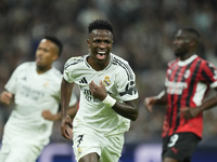 Vinicius Junior left winger of Real Madrid and Brazil celebrates after scoring his sides first goal during the UEFA Champions League 2024/25...