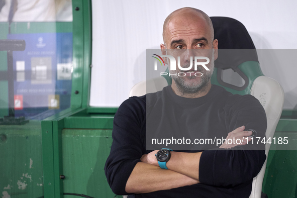 Pep Guardiola, Head Coach of Manchester City, looks on prior to the UEFA Champions League match between Sporting CP and Manchester City at J...