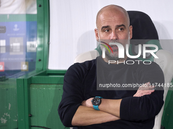 Pep Guardiola, Head Coach of Manchester City, looks on prior to the UEFA Champions League match between Sporting CP and Manchester City at J...