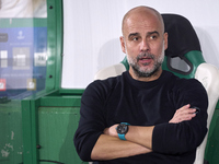 Pep Guardiola, Head Coach of Manchester City, looks on prior to the UEFA Champions League match between Sporting CP and Manchester City at J...