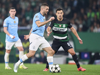 Mateo Kovacic of Manchester City is challenged by Pedro Goncalves of Sporting CP during the UEFA Champions League match between Sporting CP...