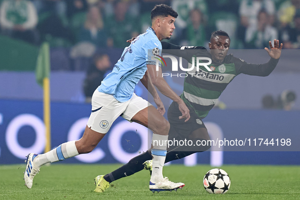 Matheus Nunes of Manchester City is challenged by Geovany Quenda of Sporting CP during the UEFA Champions League match between Sporting CP a...