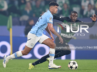 Matheus Nunes of Manchester City is challenged by Geovany Quenda of Sporting CP during the UEFA Champions League match between Sporting CP a...