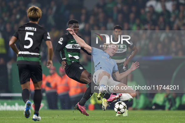 Ousmane Diomande of Sporting CP competes for the ball with Erling Haaland of Manchester City during the UEFA Champions League match between...