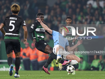 Ousmane Diomande of Sporting CP competes for the ball with Erling Haaland of Manchester City during the UEFA Champions League match between...