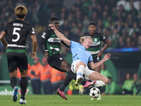 Ousmane Diomande of Sporting CP competes for the ball with Erling Haaland of Manchester City during the UEFA Champions League match between...