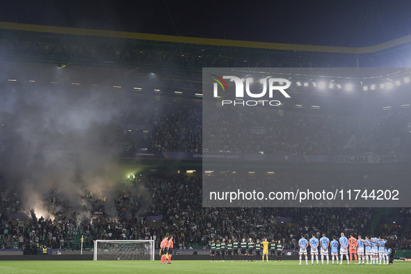 Players, match officials, and fans participate in a minute's silence for the victims of the flooding disaster in Spain before the UEFA Champ...