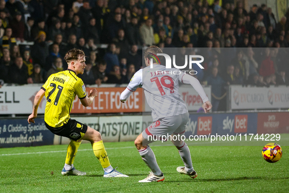 #21, Alex Bannon of Burton Albion and #19, Jeremy Kelly of Crawley Town are in action during the Sky Bet League 1 match between Burton Albio...