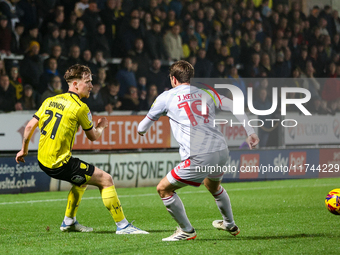 #21, Alex Bannon of Burton Albion and #19, Jeremy Kelly of Crawley Town are in action during the Sky Bet League 1 match between Burton Albio...