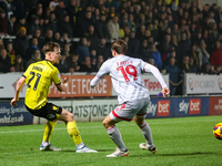 #21, Alex Bannon of Burton Albion and #19, Jeremy Kelly of Crawley Town are in action during the Sky Bet League 1 match between Burton Albio...