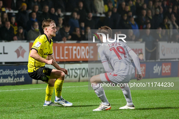 #21, Alex Bannon of Burton Albion and #19, Jeremy Kelly of Crawley Town are in action during the Sky Bet League 1 match between Burton Albio...