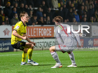 #21, Alex Bannon of Burton Albion and #19, Jeremy Kelly of Crawley Town are in action during the Sky Bet League 1 match between Burton Albio...