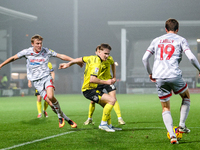 #21, Alex Bannon of Burton Albion loses out to #19, Jeremy Kelly of Crawley Town during the Sky Bet League 1 match between Burton Albion and...