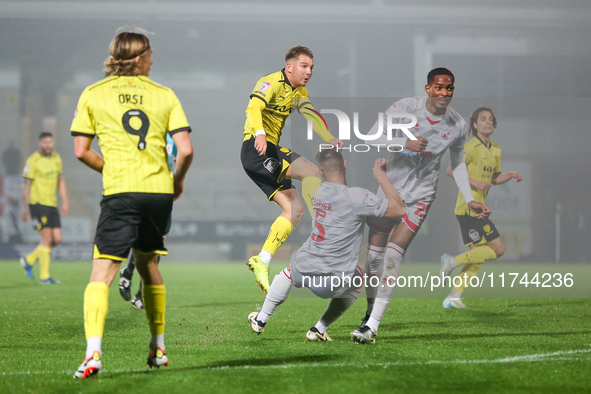 Number 34, Ben Whitfield of Burton Albion (center), attempts a shot on goal during the Sky Bet League 1 match between Burton Albion and Craw...