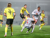 Number 34, Ben Whitfield of Burton Albion (center), attempts a shot on goal during the Sky Bet League 1 match between Burton Albion and Craw...