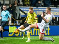 Number 34, Ben Whitfield of Burton Albion, is intercepted by number 5, Charlie Barker of Crawley Town during the Sky Bet League 1 match betw...