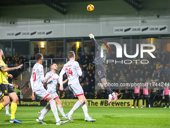 Goalkeeper Connal Trueman, 31, of Crawley Town makes the save during the Sky Bet League 1 match between Burton Albion and Crawley Town at th...