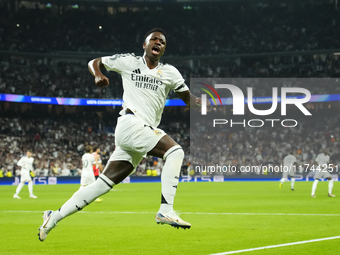 Vinicius Junior left winger of Real Madrid and Brazil celebrates after scoring his sides first goal during the UEFA Champions League 2024/25...