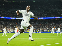 Vinicius Junior left winger of Real Madrid and Brazil celebrates after scoring his sides first goal during the UEFA Champions League 2024/25...