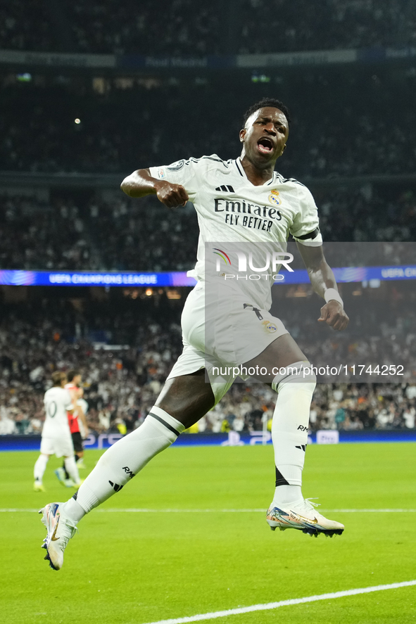 Vinicius Junior left winger of Real Madrid and Brazil celebrates after scoring his sides first goal during the UEFA Champions League 2024/25...