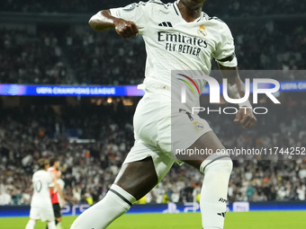 Vinicius Junior left winger of Real Madrid and Brazil celebrates after scoring his sides first goal during the UEFA Champions League 2024/25...