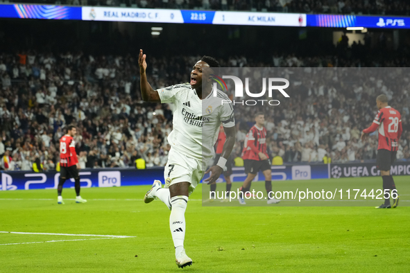 Vinicius Junior left winger of Real Madrid and Brazil celebrates after scoring his sides first goal during the UEFA Champions League 2024/25...