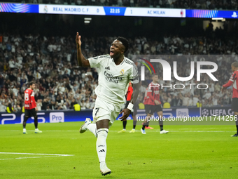 Vinicius Junior left winger of Real Madrid and Brazil celebrates after scoring his sides first goal during the UEFA Champions League 2024/25...