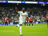 Vinicius Junior left winger of Real Madrid and Brazil celebrates after scoring his sides first goal during the UEFA Champions League 2024/25...