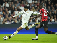 Jude Bellingham central midfield of Real Madrid and England  shooting to goal front Fikayo Tomori centre-back of AC Milan and England during...