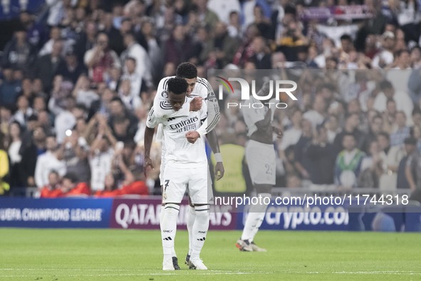 Vinicius Jr. of Real Madrid and Jude Bellingham of Real Madrid celebrate a goal during the UEFA Champions League 2024/25 match between Real...