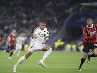 Kylian Mbappe of Real Madrid controls the ball during the UEFA Champions League 2024/25 match between Real Madrid and AC Milan at Santiago B...