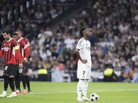 Vinicius Jr of Real Madrid prepares to shoot a penalty during the UEFA Champions League 2024/25 match between Real Madrid and AC Milan at Sa...