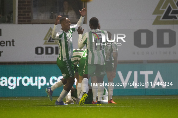 Richard Kone #24 of Wycombe Wanderers F.C. celebrates his goal with teammates during the Sky Bet League 1 match between Stockport County and...