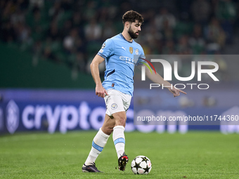 Josko Gvardiol of Manchester City is in action during the UEFA Champions League match between Sporting CP and Manchester City at Jose Alvala...