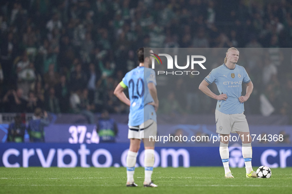 Erling Haaland and Bernardo Silva of Manchester City react after Viktor Gyokeres of Sporting CP scores his team's first goal during the UEFA...