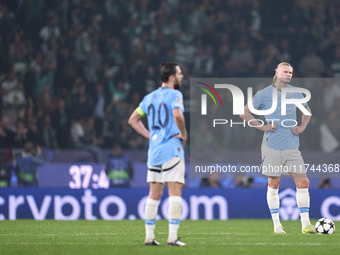 Erling Haaland and Bernardo Silva of Manchester City react after Viktor Gyokeres of Sporting CP scores his team's first goal during the UEFA...