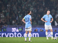 Erling Haaland and Bernardo Silva of Manchester City react after Viktor Gyokeres of Sporting CP scores his team's first goal during the UEFA...