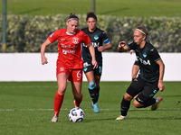 Mina Bergersen of F.C. Como Women and Zsanett Kajan of S.S. Lazio participate in the round of 16 of Coppa Italia Femminile between S.S. Lazi...