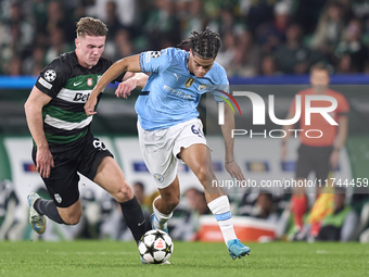 Viktor Gyokeres of Sporting CP competes for the ball with Jahmai Simpson-Pusey of Manchester City during the UEFA Champions League match bet...