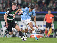 Viktor Gyokeres of Sporting CP competes for the ball with Jahmai Simpson-Pusey of Manchester City during the UEFA Champions League match bet...