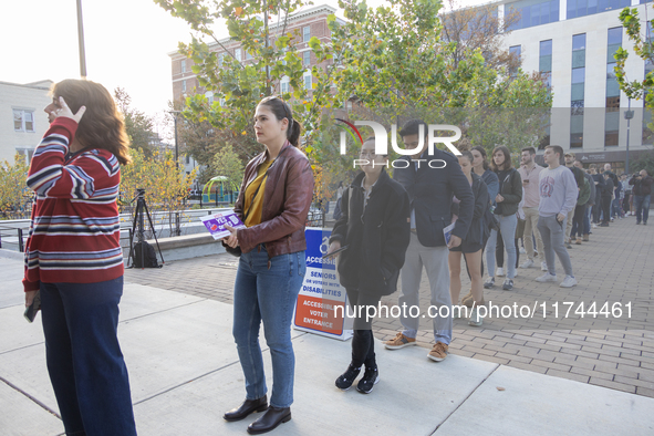 Voters stand in line at a local polling station in Washington, DC, on November 5, 2024. Americans cast their ballots in the presidential rac...