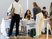 Voters stand in line at a local polling station in Washington, DC, on November 5, 2024. Americans cast their ballots in the presidential rac...